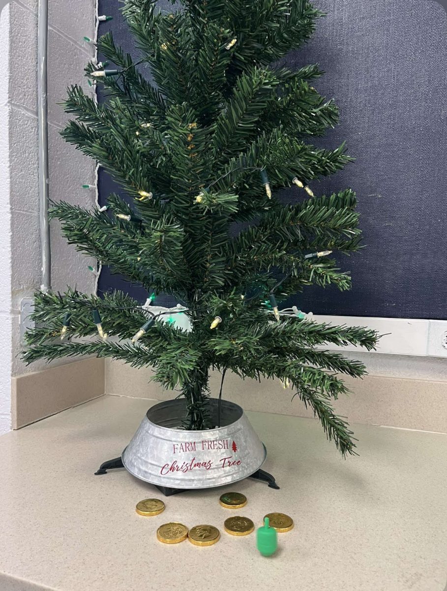 Mrs. Claffey’s holiday decorations with a dreidel and gelt. 