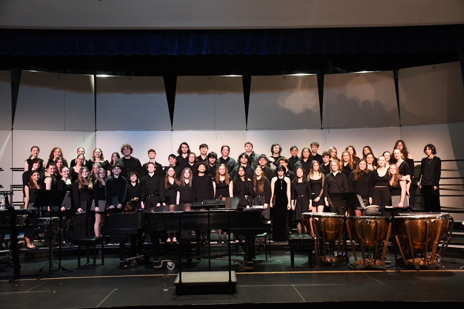 The combined upper and underclassmen choir on the OSHS stage. 
