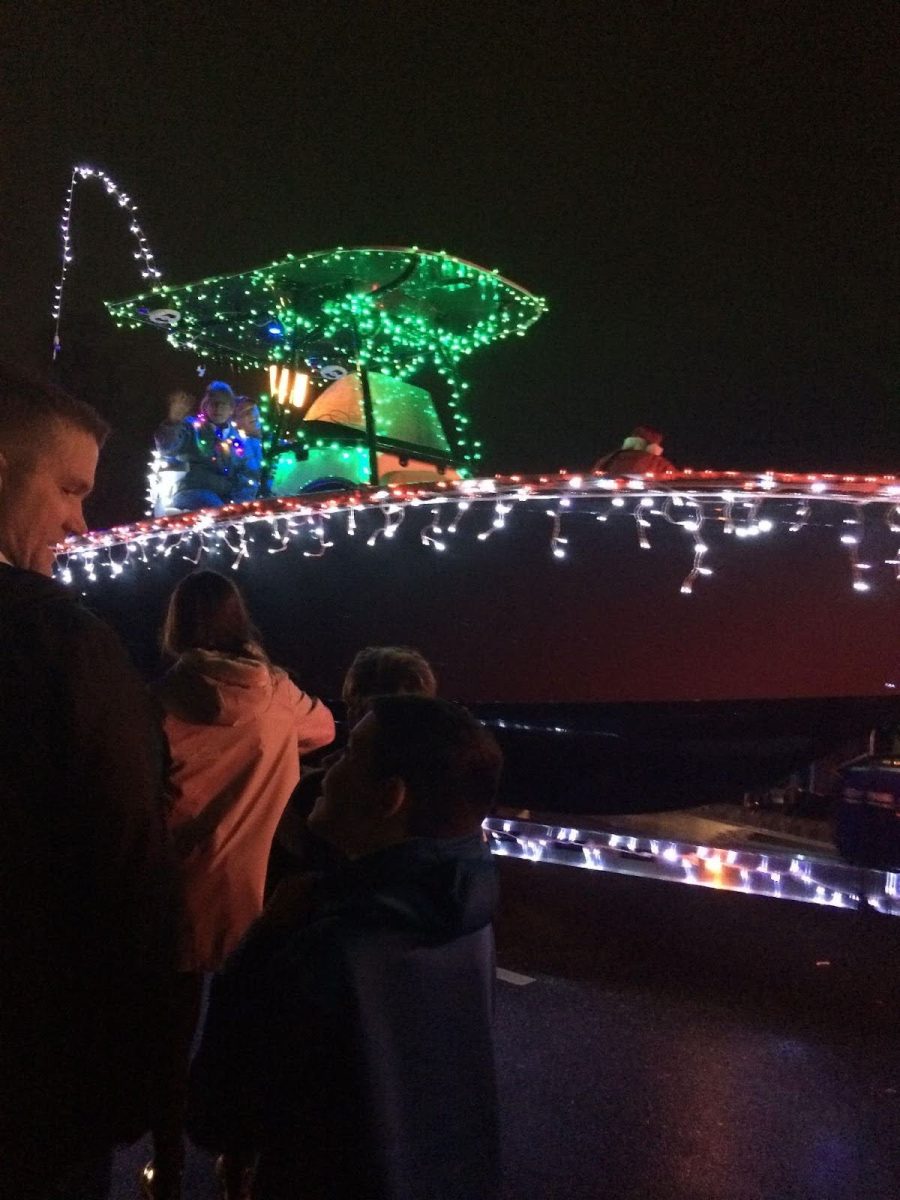 A boat decorated in lights during the Torchlight parade
