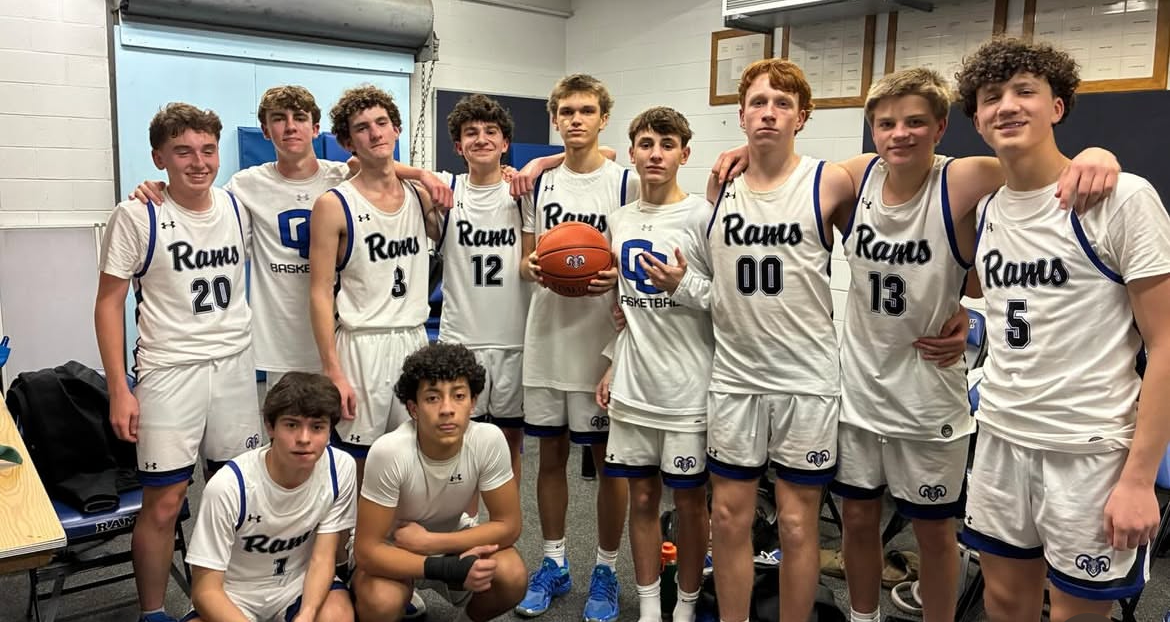 Image of the boys basketball team featured on the news after a win
