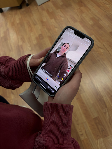 An OSHS student watching Ann Micheal Maye’s TikTok.