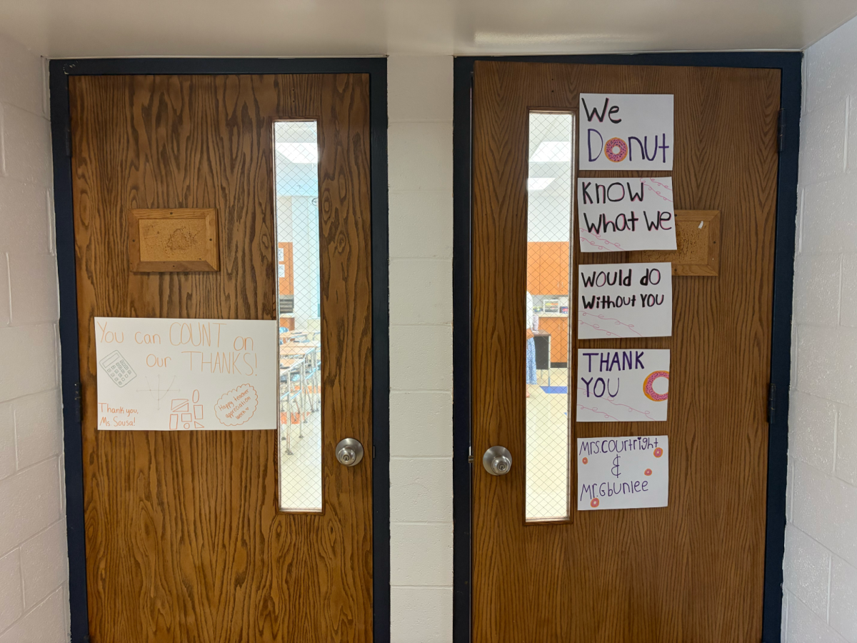 Mrs. Sousa’s classroom door (left) and Mrs. Courtright’s/Mr. Gbunblee’s classroom door (right) decorated with kind words from the DECA club, among other clubs who participated in hanging kind words on the doors of teachers’ classrooms.
