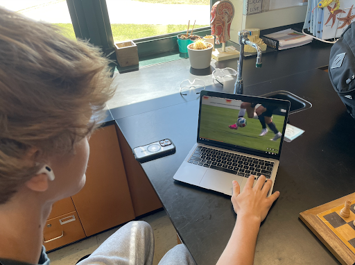 Student, Tavin Royster ‘28 watches U.S. vs Germany game highlights on laptop